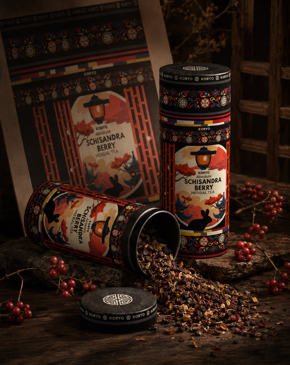 KORYO Absolute Schisandra Berry Herbal Tea cylindrical packaging displayed with loose tea, red berries, and illustrated label artwork.