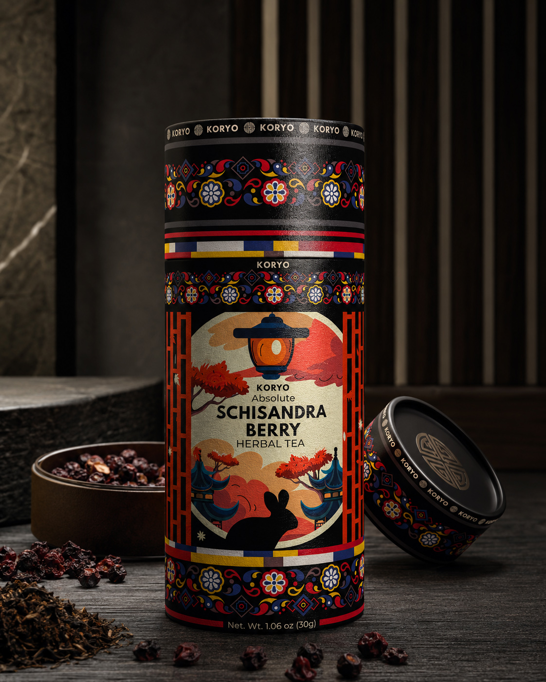 Final KORYO Schisandra Berry Herbal Tea canister displayed with its branded lid, loose herbal tea, and dried Schisandra berries.