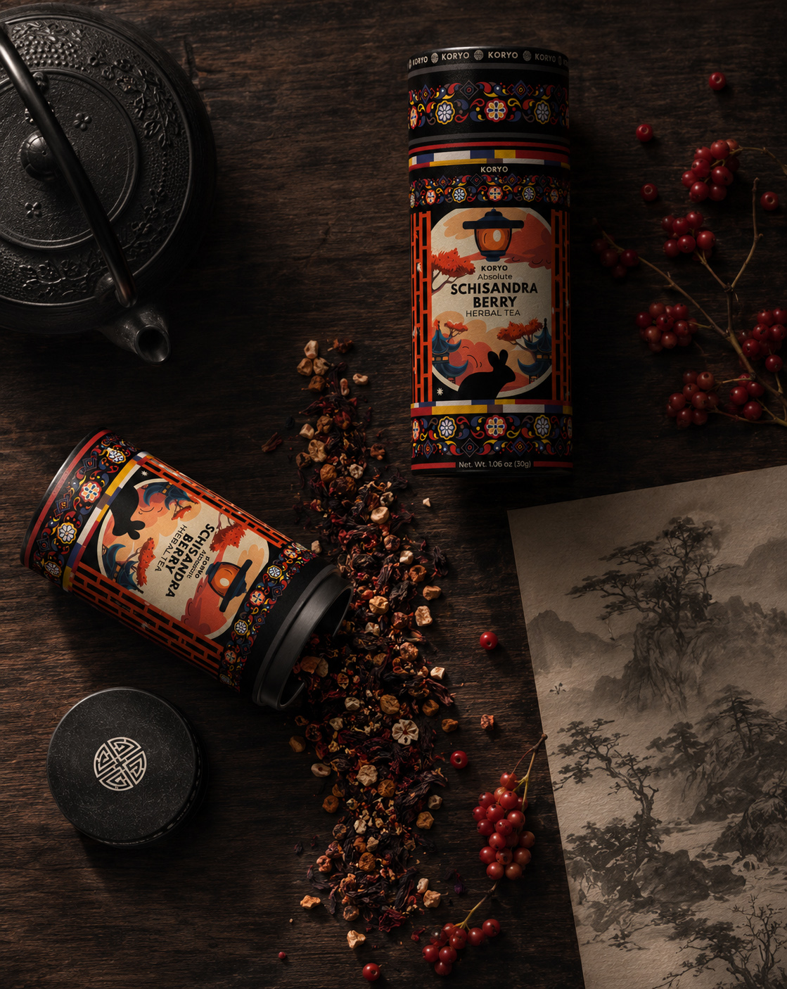 KORYO Schisandra Berry Herbal Tea packaging arranged with loose tea, red berries, cast-iron teaware, branded lids, and Korean-inspired landscape artwork.