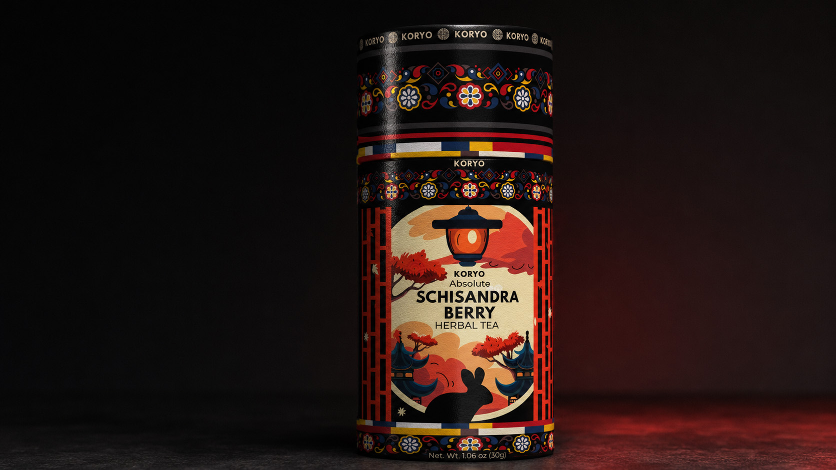 Front-facing KORYO Schisandra Berry Herbal Tea canister presented against a dark background with restrained red illumination.
