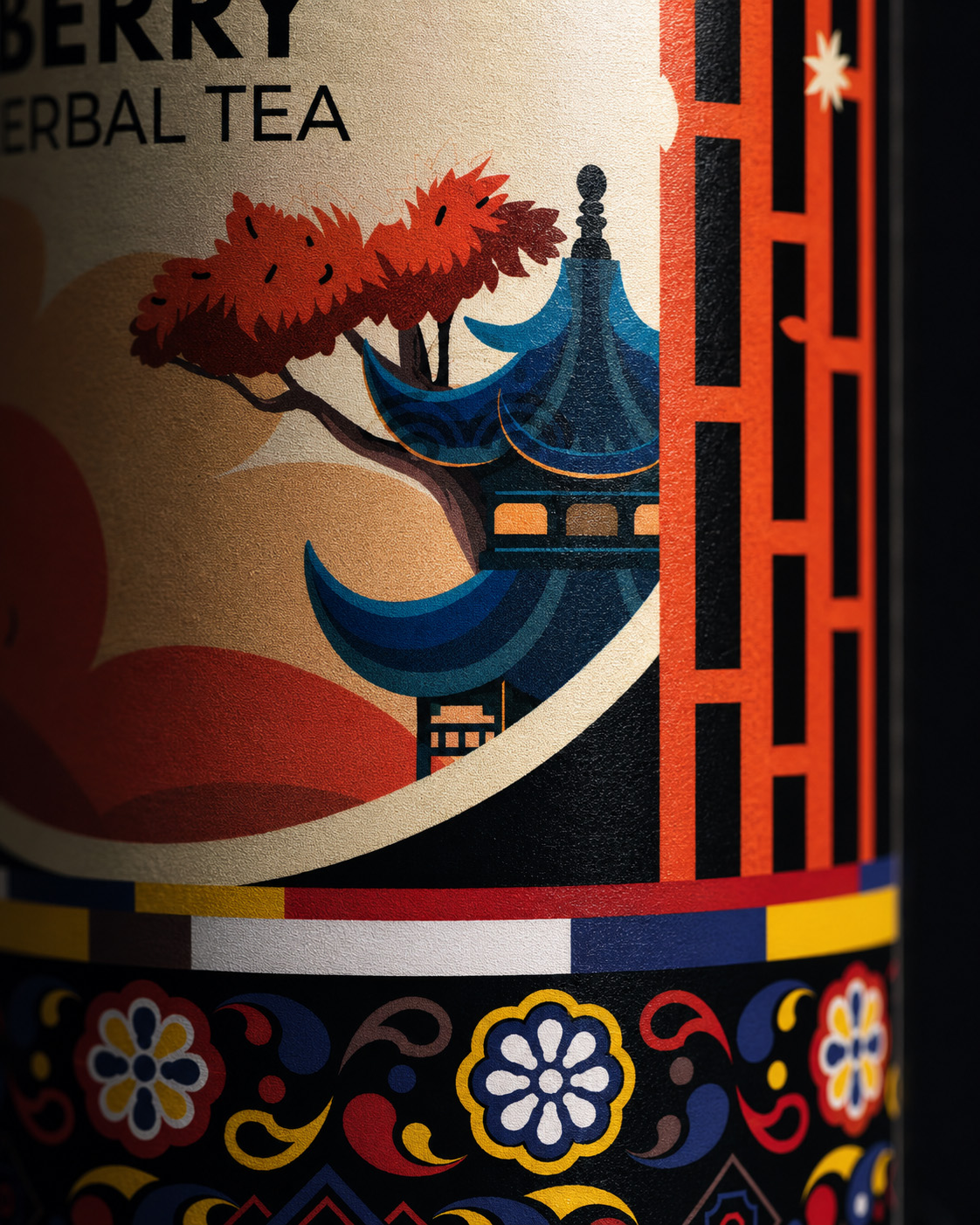 Macro detail of KORYO Schisandra Berry Herbal Tea packaging showing Korean-inspired pavilion architecture, red foliage, multicolor bands, ornamental borders, and textured print.