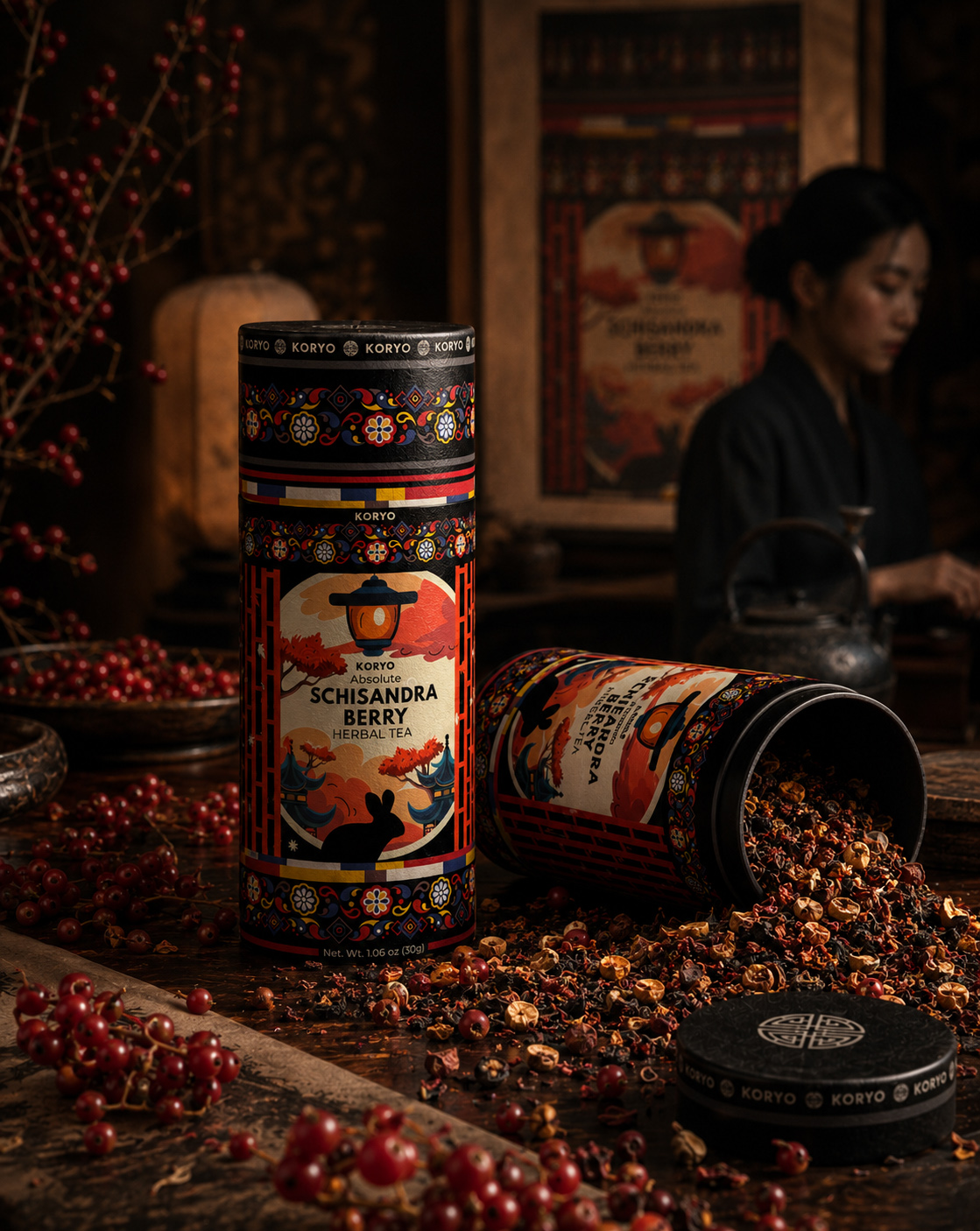 Close product view of KORYO Schisandra Berry Herbal Tea packaging with an opened cylinder, loose tea blend, and red berries.