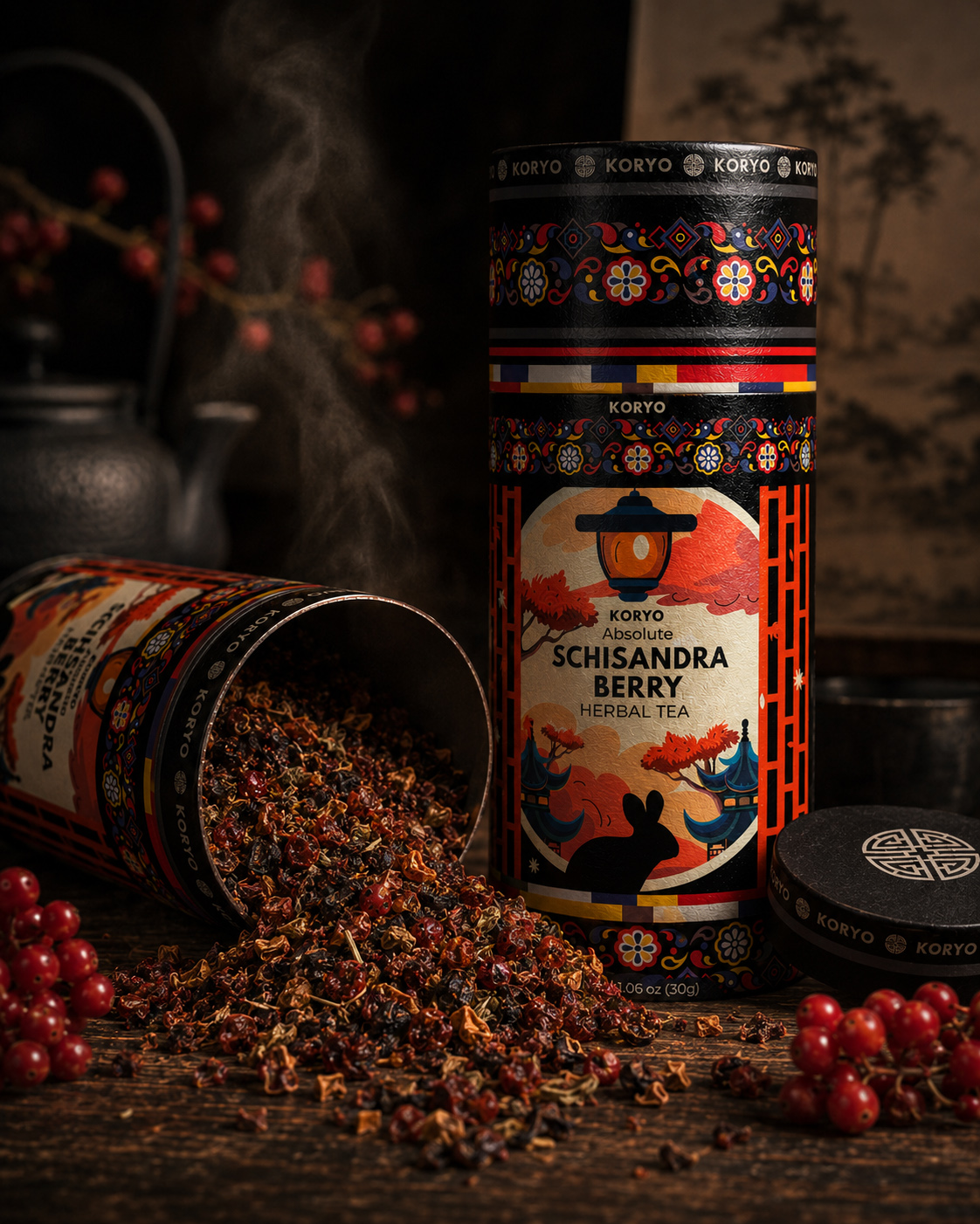 Close product view of KORYO Schisandra Berry Herbal Tea packaging with an opened cylinder, loose tea blend, and red berries.