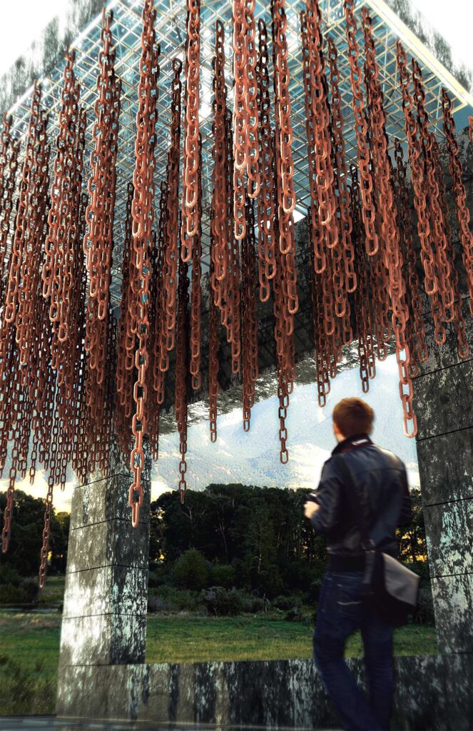 Visitor standing beneath a monumental architectural installation formed by suspended rusted chains and a structural frame.