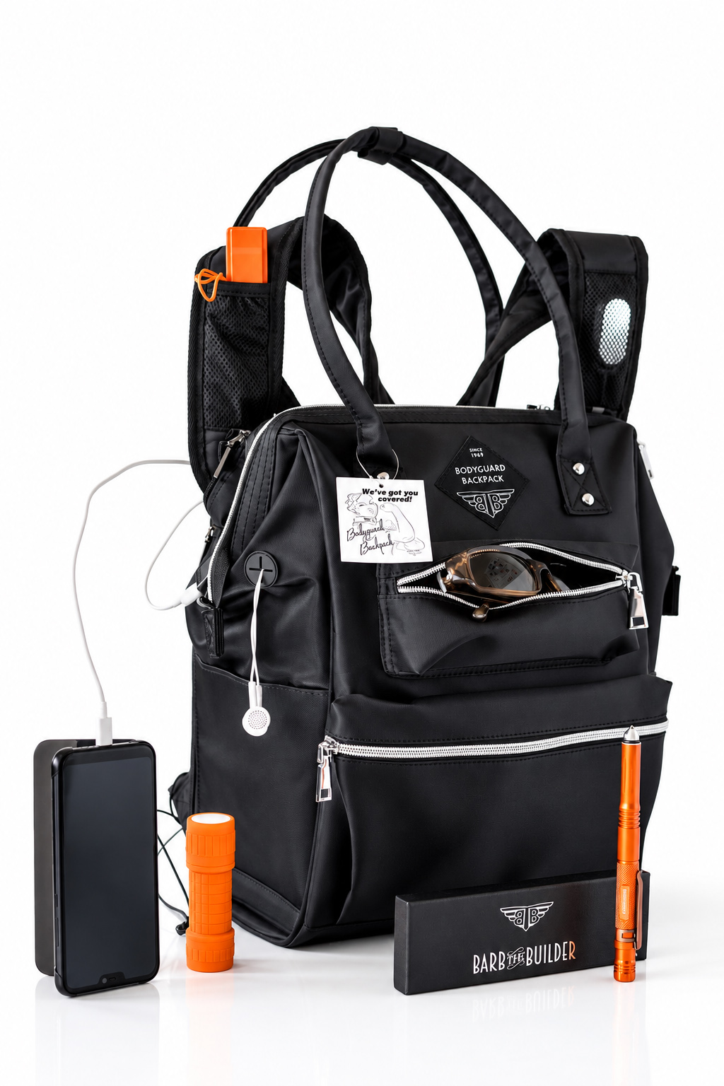 BodyGuard Backpack photographed on a clean white background with a power bank, flashlight, glasses, charging cable, and branded accessories arranged around the product.