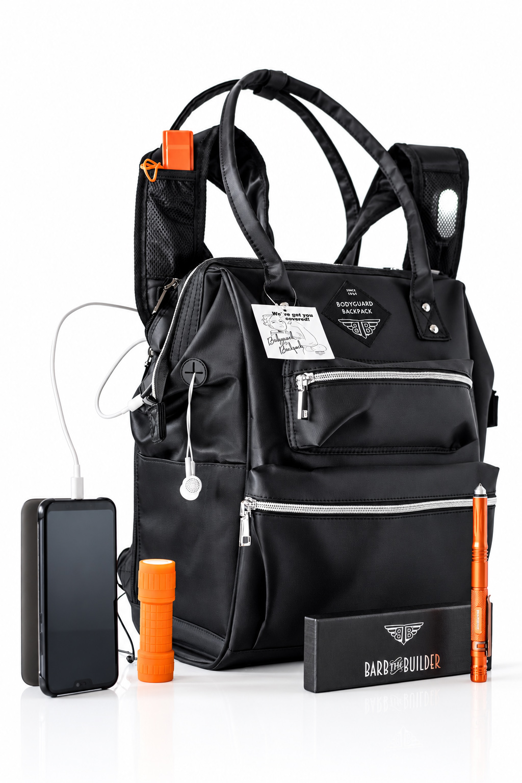 BodyGuard backpack photographed in a clean ambient product setup with supporting accessories, showing a clear subject hierarchy and controlled visual emphasis.